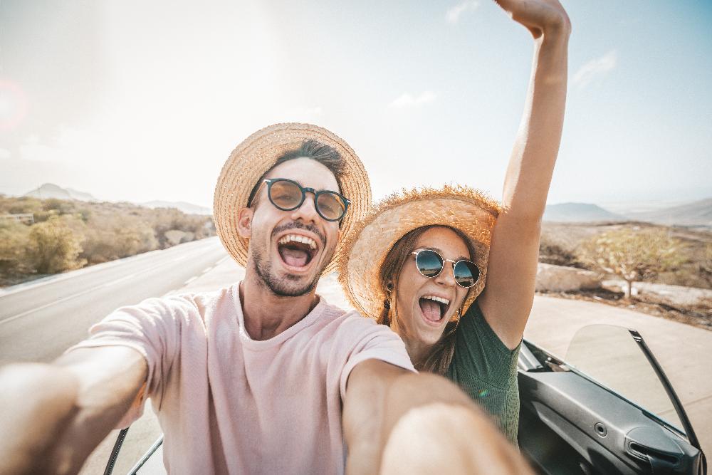 young couple smiling in car l dentist near wylie tx